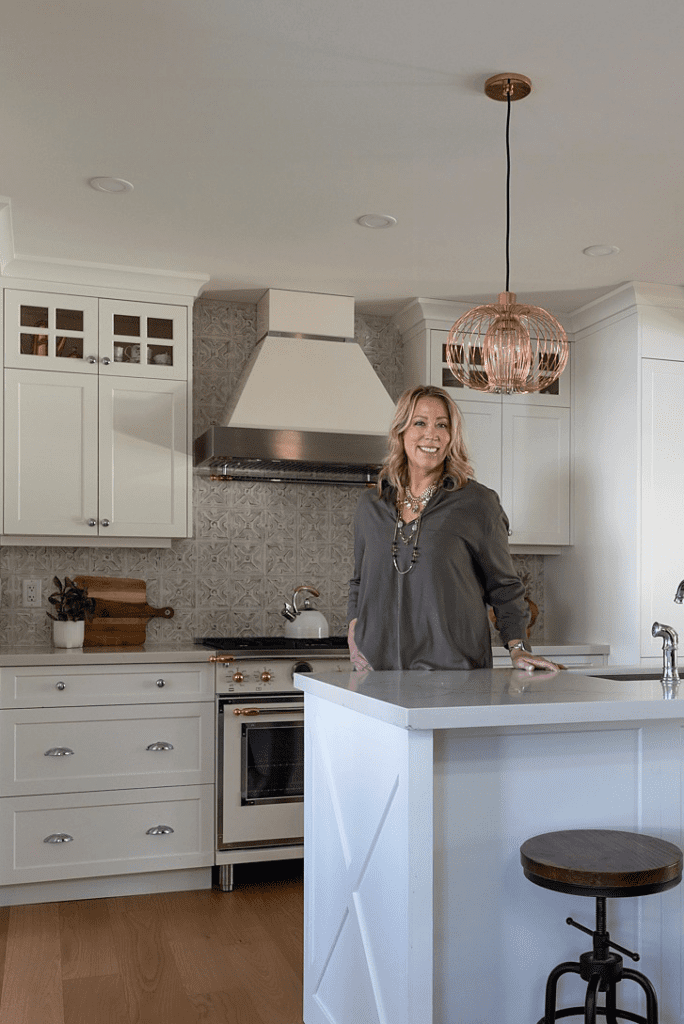 Lesley Hauville, a professional Calgary Realtor, showcasing a modern, spacious kitchen in a Calgary home for sale.